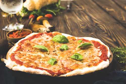Fresh Pizza on wooden table